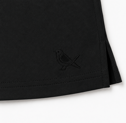 Approach Skort in Black, tonal bird embroidery detail | Iron Muse Golf