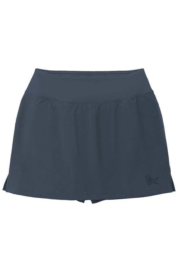 Approach Skort in True Navy with tonal bird logo, product mockup | Iron Muse Golf