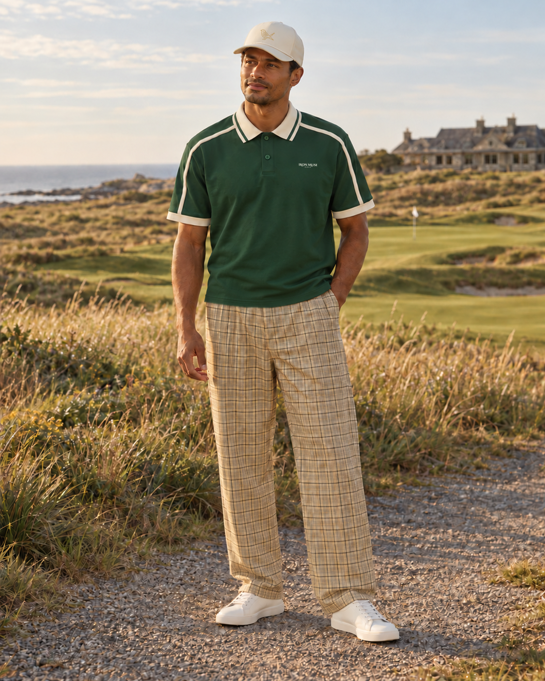 A Little Tradition: model wearing an untucked Dark Green Links Stripe Polo, Apricot Plaid Clubhouse Plaid Pant, and Ivory Heritage Rope.